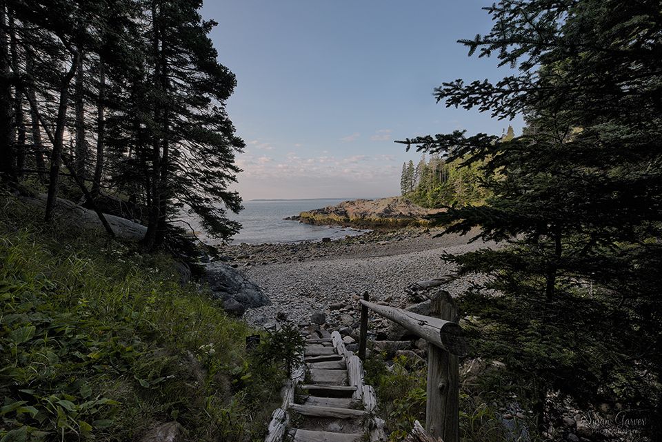 “Wooden stairwell leading through spruce trees down to the cobblestone shoreline at Little Hunters Beach in Acadia National Park, Maine. “Wooden stairwell leading through spruce trees down to the cobblestone shoreline at Little Hunters Beach in Acadia National Park, Maine.